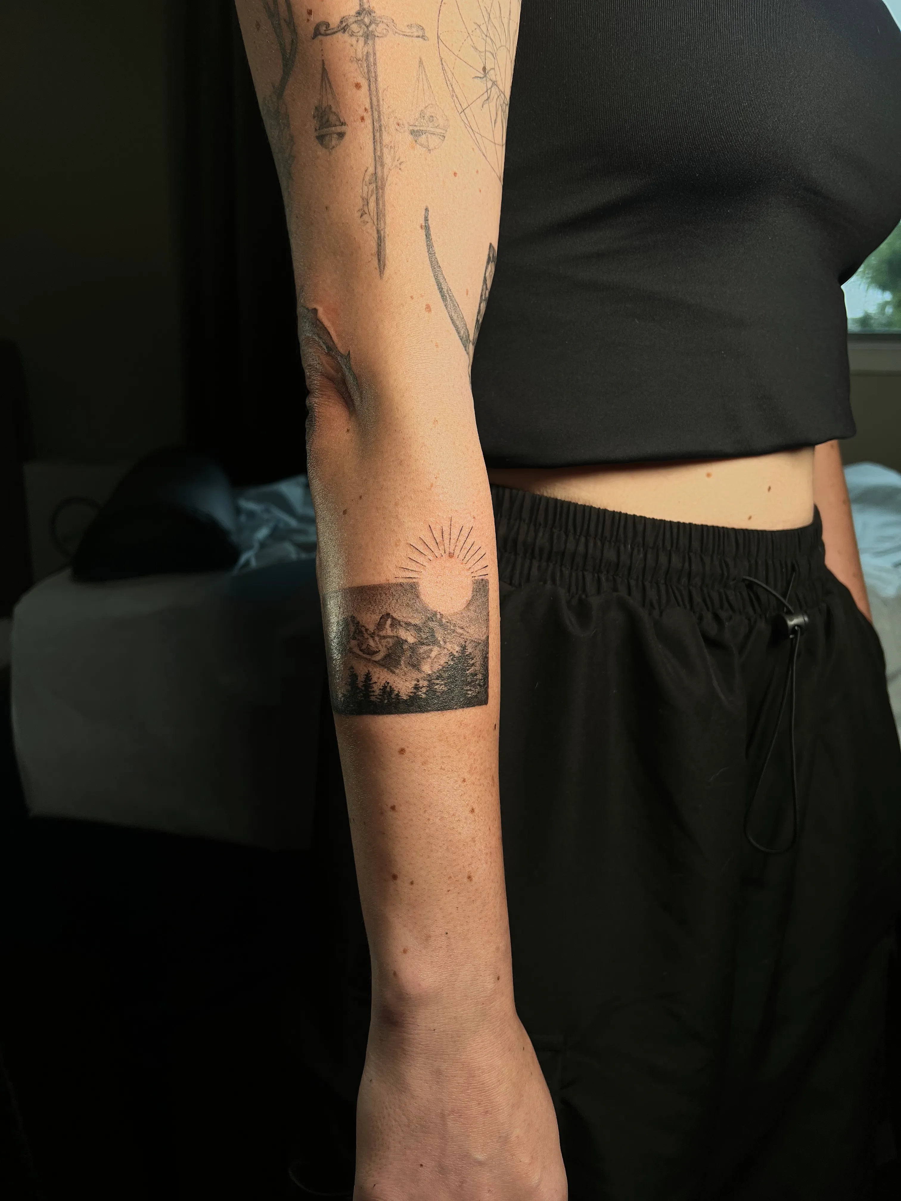 Mountain Sunset — Blackwork band, fine-line tattoo, Forearm, by Yiwu Duan, Toronto